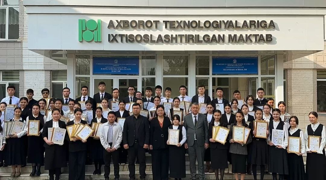 Students displaying certificates and awards with school officials in front of Secondary School No. 8